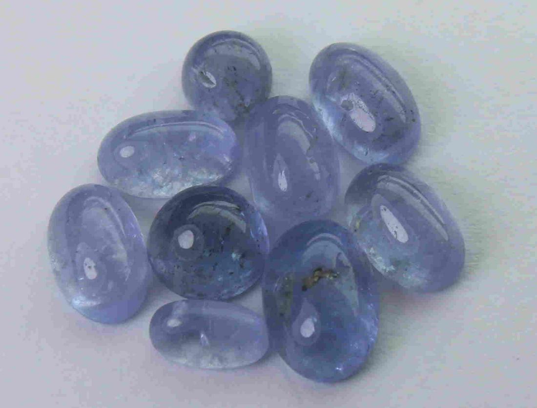 4.64 cts Natural Tanzanite Lot: No Reserve! Title: 4.64 cts Natural Tanzanite Lot Additional Information: Gemstone : Natural Tanzanite Shape and cut : Oval cabochan round cabochan Weight : 4.64 Carats Measurements : 6.75x4.57x2.71 m