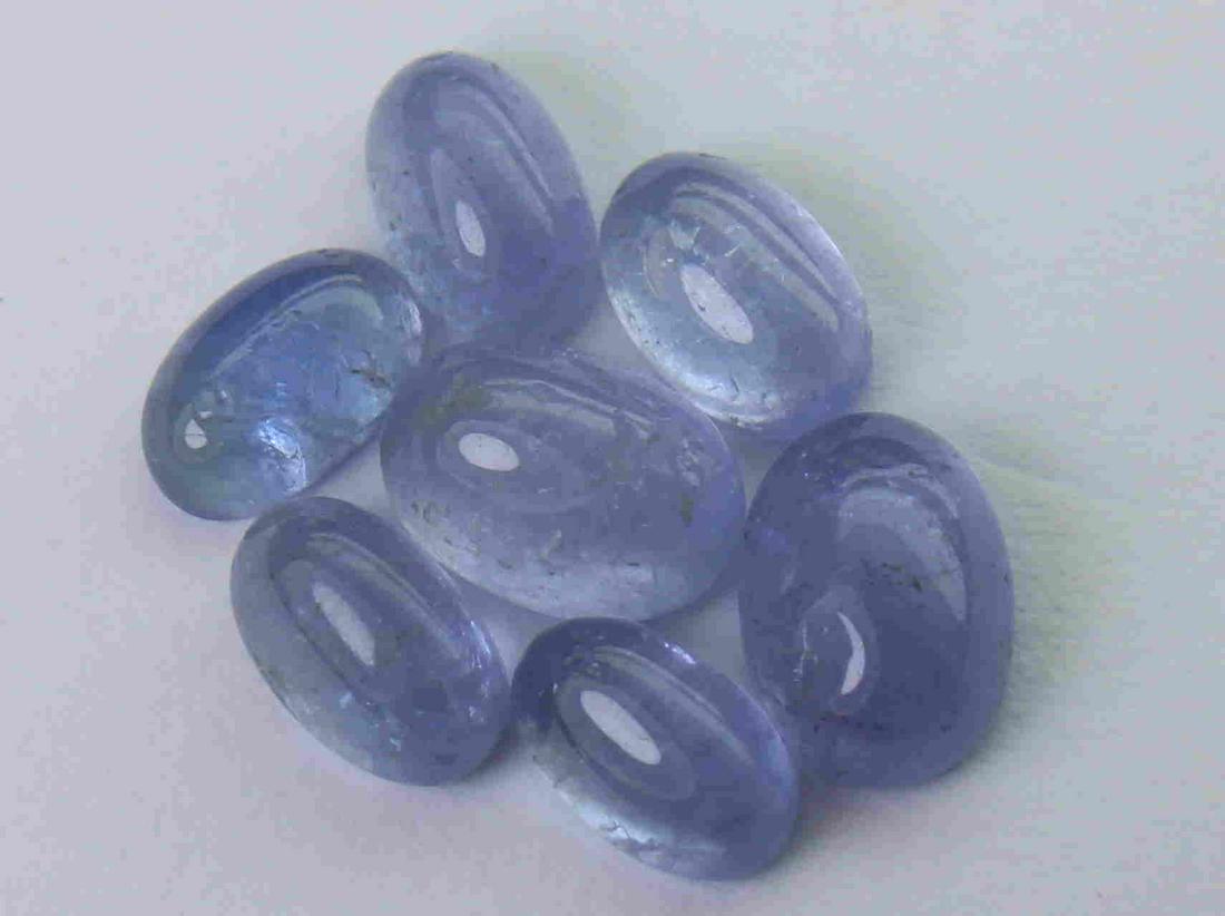 4.13 cts Natural Tanzanite Lot: No Reserve! Title: 4.13 cts Natural Tanzanite Lot Additional Information: Gemstone : Natural Tanzanite Shape and cut : Oval cabochan Weight : 4.32 Carats Measurements : 6.90x6.83x2.95 mm , 5.70x3.64x2