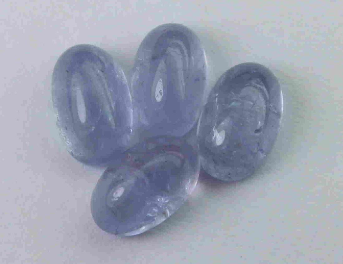 2.10 cts Natural Tanzanite Lot: No Reserve! Title: 2.10 cts Natural Tanzanite Lot Additional Information: Gemstone : Natural Tanzanite Shape and cut : Oval cabochan Weight : 2.10 Carats Measurements : 5.57x3.57x2.55 mm, 5.89x3.68x3.