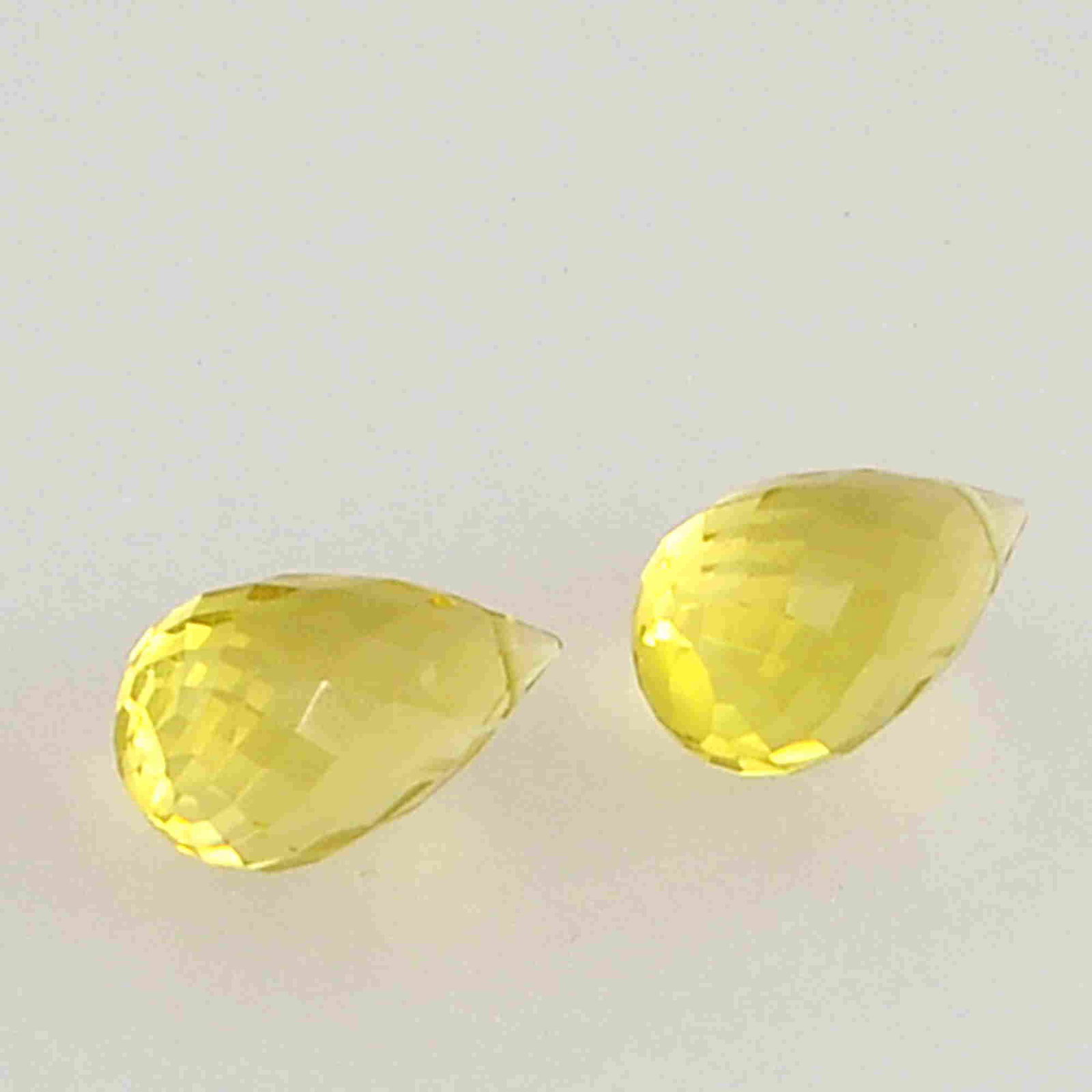 6.3 Carat Yellow Color Natural Drops Lemon Quartz Loose: No Reserve! Title: 6.3 Carat Yellow Color Natural Drops Lemon Quartz Loose Gemstone 2 Pieces Brand: Gems Trading Center Gemstones: Lemon Quartz Carat Weights: 6.3 Size/Dimensions: 7H x 11.5L x 7W mm S