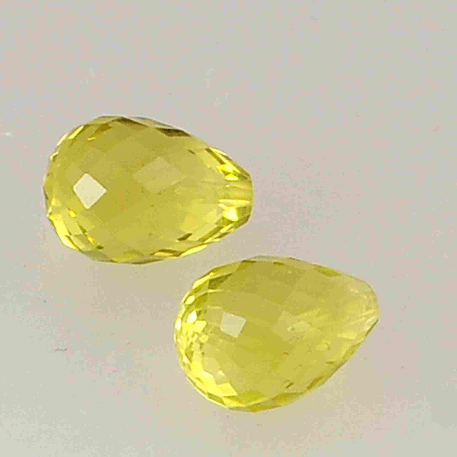 7.2 Carat Yellow Color Natural Drops Lemon Quartz Loose: No Reserve! Title: 7.2 Carat Yellow Color Natural Drops Lemon Quartz Loose Gemstone 2 Pieces Brand: Gems Trading Center Gemstones: Lemon Quartz Carat Weights: 7.2 Size/Dimensions: 7.5H x 10L x 7.5W mm