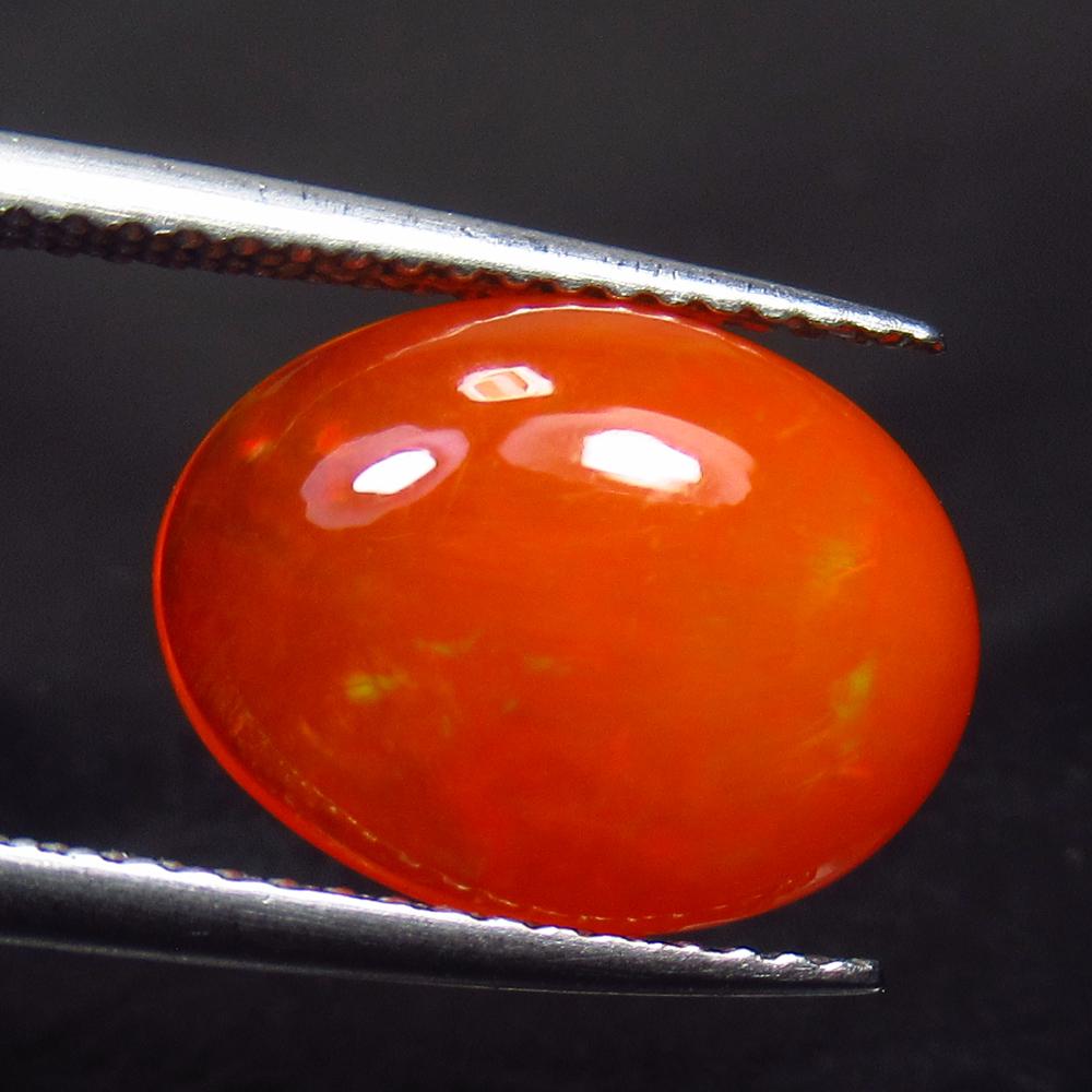 2.81 Ctw Natural Ethiopian Orange Fire Opal Oval Cab: No Reserve! Title: 2.81 Ctw Natural Ethiopian Orange Fire Opal Oval Cab Stone Clarity: Transparent Gemstones: Black Opal Carat Weights: 2.81 Size/Dimensions: 13.10 x 10.00 x 4.50 mm Additional Informa