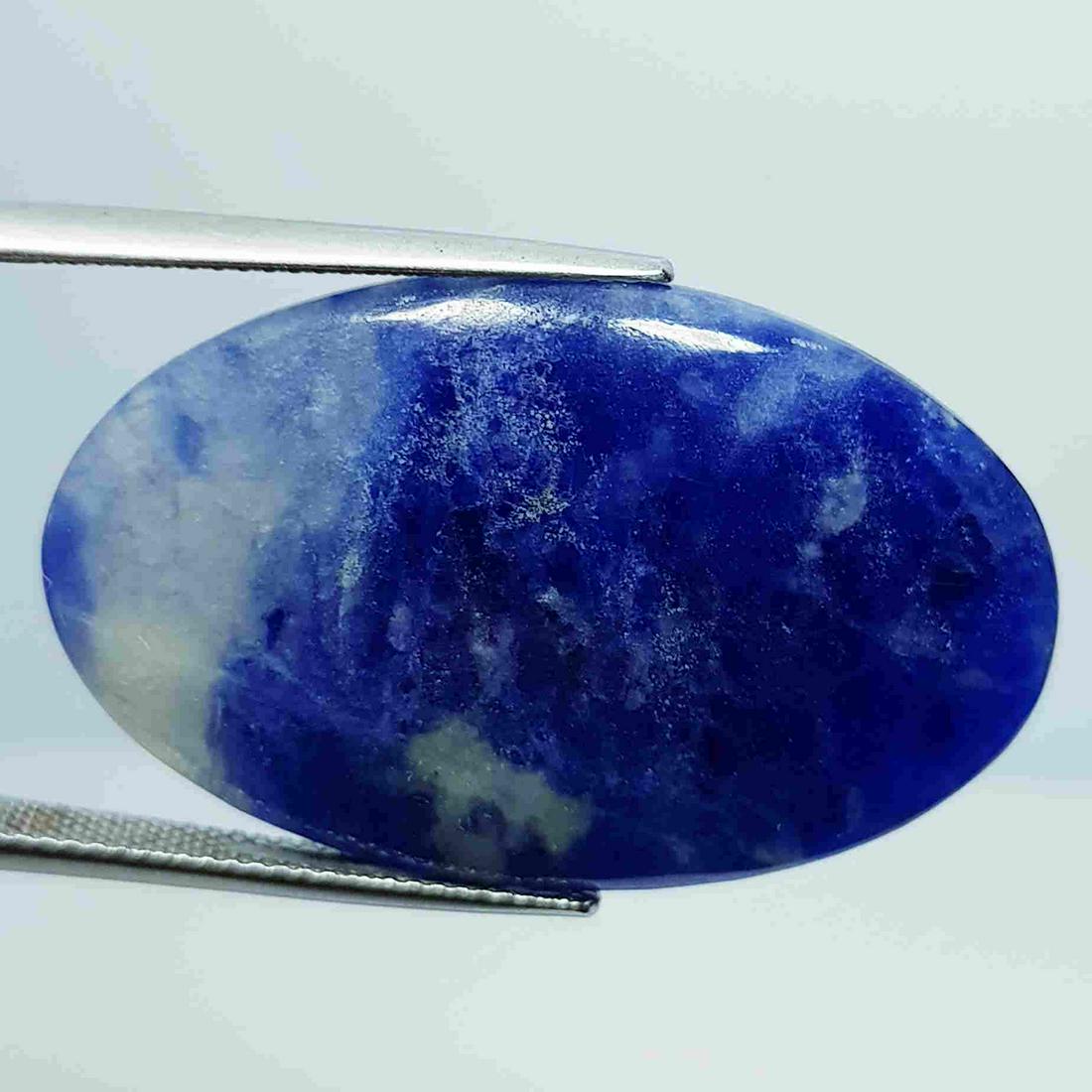 25.40 ct Natural Sodalite: No Reserve! Title: 25.40 ct Natural Sodalite Color/Clarity: Opaque Gemstones: Loosegemstone Carat Weights: 25.4 Size/Dimensions: 36.30 x 22.65 x 4.25 Additional Information: Oval - Brazil Shipping: