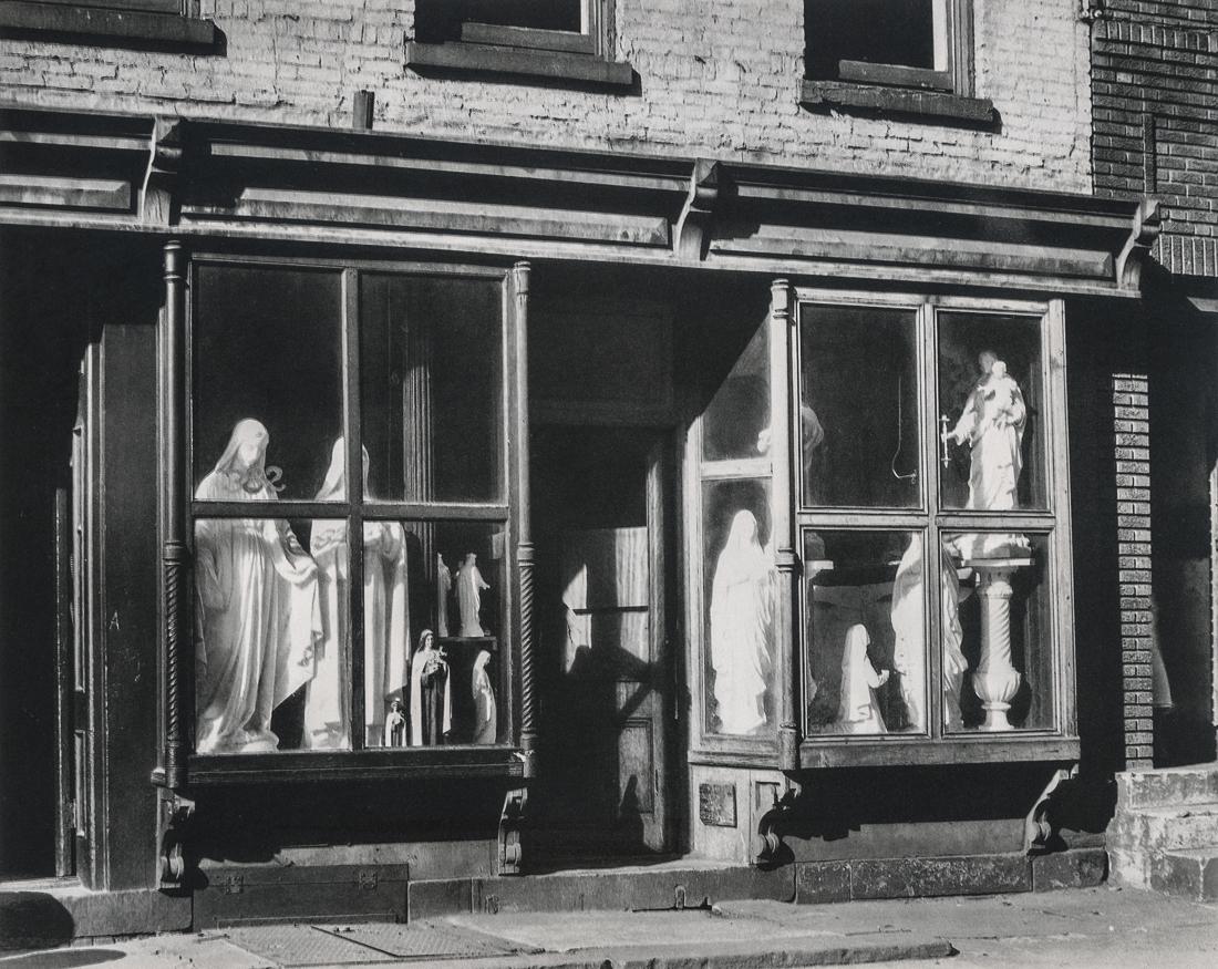 BERENICE ABBOTT - Saints for Sale: Artist: Berenice Abbott Title: Saints for Sale Medium: Photo Litho, 1982, Japan Dimensions: 8.5x6.75" Description: Heat Wax Mounted on 8.5x11" Conservation Board Artist Bio: Berenice Abbot, originally