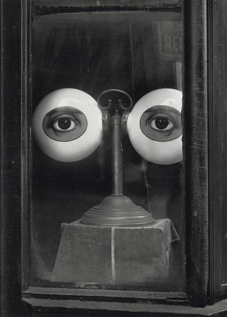 IRVING PENN - Optician's Shop Window, New York, 1939: Artist: Irving Penn Title: Optician's Shop Window, New York, 1939 Medium: Photo Litho, 1991, USA Dimensions: 7.2x10.05" Description: Heat Wax Mounted on 11x14" Conservation Board Artist Bio: Irving Pe