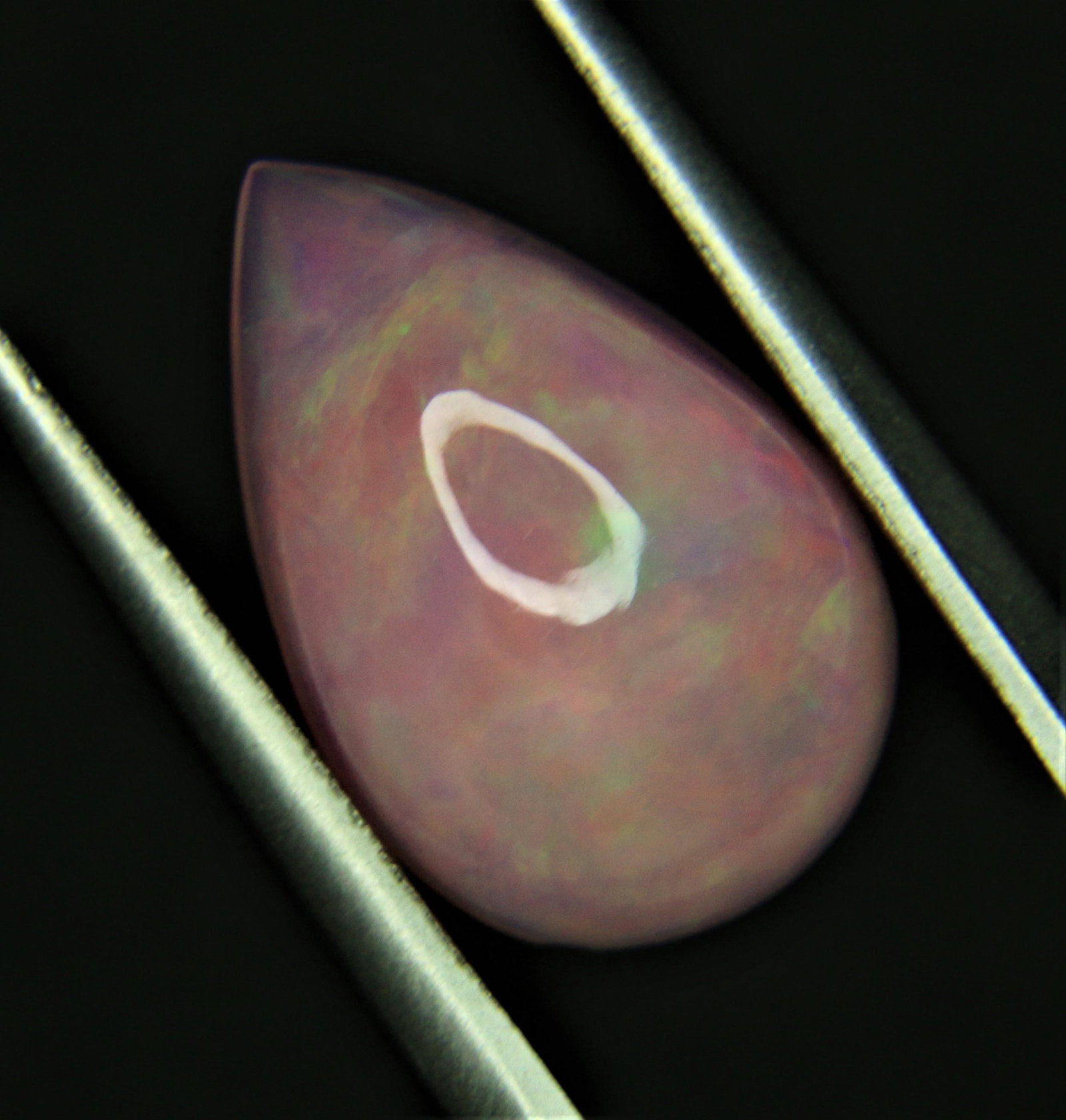 4.35ct Welo Pink Opal: Title: 4.35ct Welo Pink Opal Size (mm): 15.8x10.4x5.7 Weight (carat): 4.35 ct Cut/Shape: Pear Cabachon Reserve: $70.00 Shipping: Domestic: Flat-rate of $18.00 (Standard Royal) or $55.00 (DHL Express