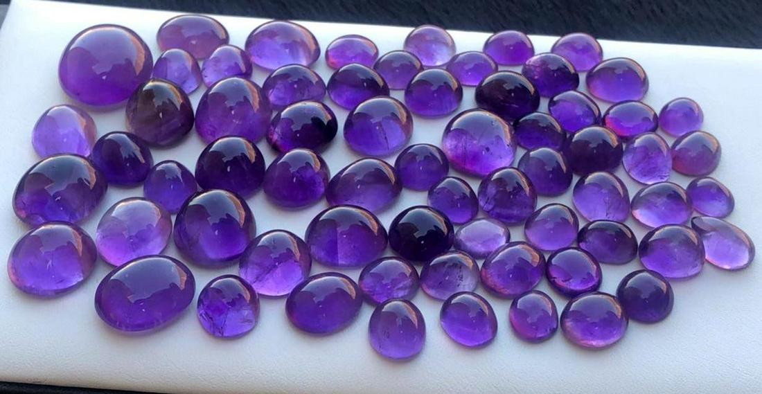 446 Carats Beautiful Purple Amethyst Cabochons: Title: 446 Carats Beautiful Purple Amethyst Cabochons Origin: Pakistan Gemstones: Amethyst Carat Weights: 446 Carats Size/Dimensions: 9x7x5mm to 21x17x10 mm ( 66 Pieces ) Additional Information: Natur