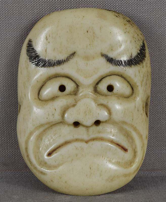 19c netsuke MASK KO-BESHIMI: 19th century staghorn netsuke of a Noh theater mask of a man with a pensive face - most probably that of Ko-Beshimi. Excellent facial expression, beautifully incised and etched black ink eyebrows, red