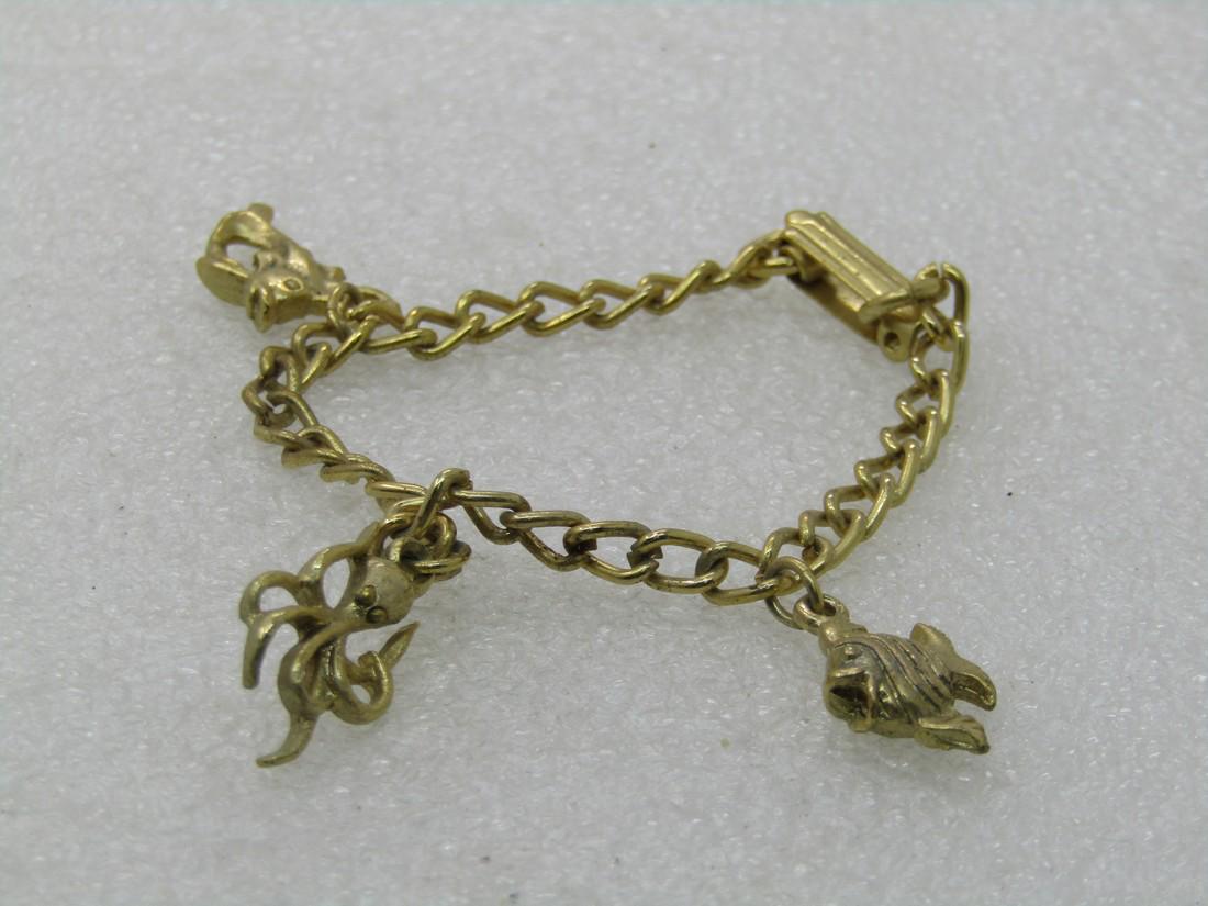 Vintage Sealife Charm Bracelet, 6" Gold tone, 1960's,: Vintage Sealife Charm Bracelet, 6" Gold tone, 1960's, Teen to Adult. 4mm wide chain with a tropical fish, squid and other fish. Not signed by the maker. Very good condition. (INV. W.112020.6 SS3415 J