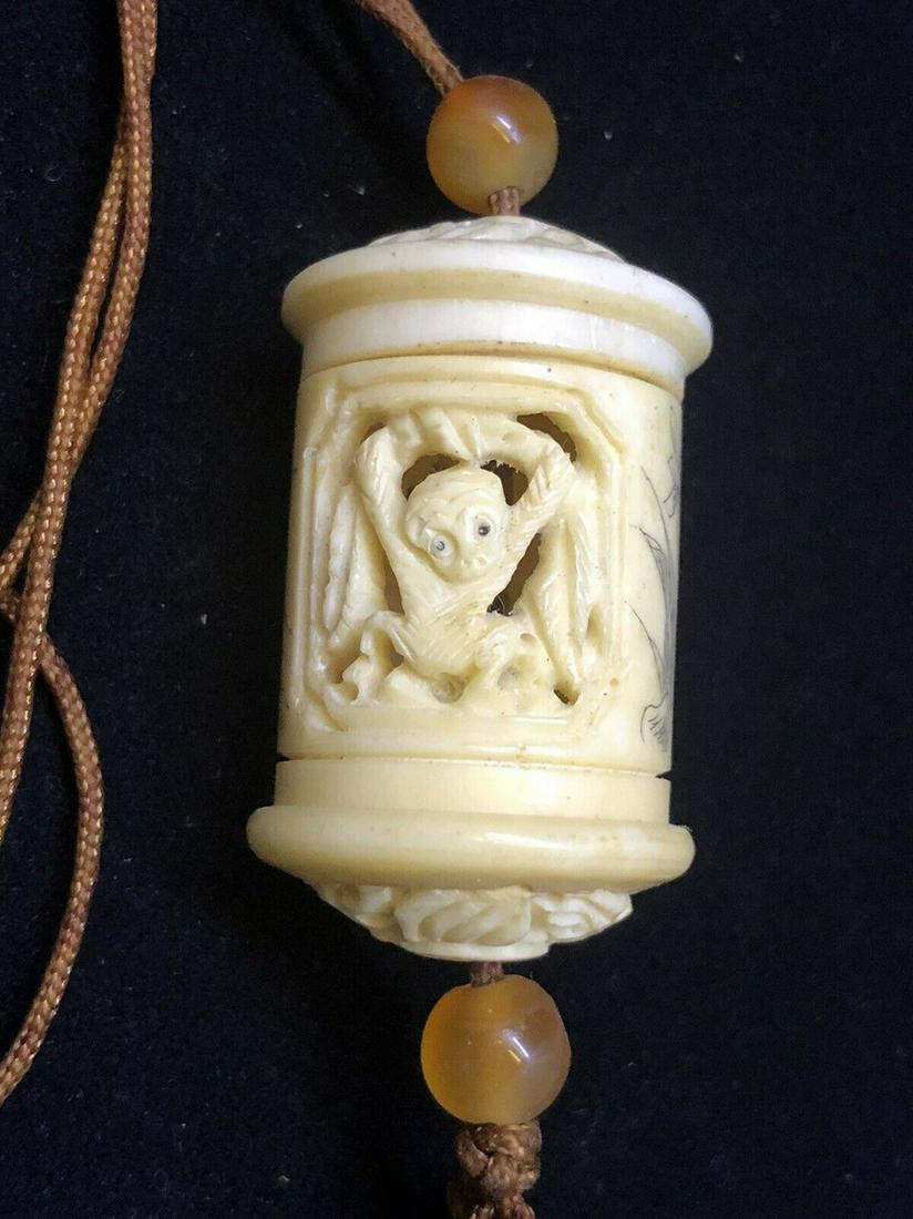 Japanese Netsuke inro pill box necklace buffalo bone: Title: Japanese Netsuke inro pill box necklace buffalo bone Date/Period: 20 century Materials: Buffalo bone Dimensions: 1.7 x 1 inch Description:Japanese buffalo bone inro, all handcarved with monkey