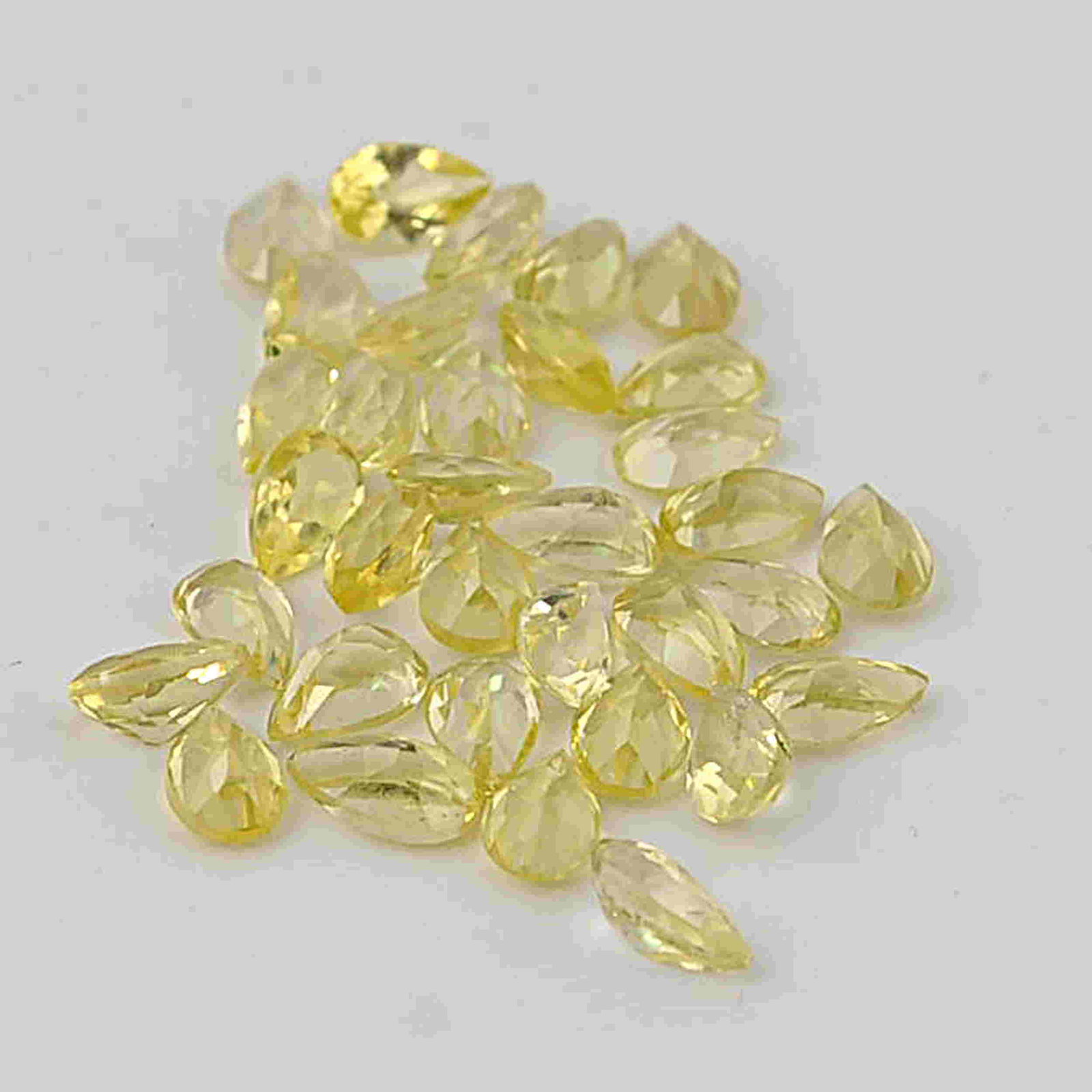 6.38 Carat Yellow Color Natural Pear Lemon Quartz Loose: No Reserve! Title: 6.38 Carat Yellow Color Natural Pear Lemon Quartz Loose Gemstone 34 Pieces Additional Information: Specification of Gemstone Name : Lemon Quartz Color : Yellow Total Weight : 6.38 C