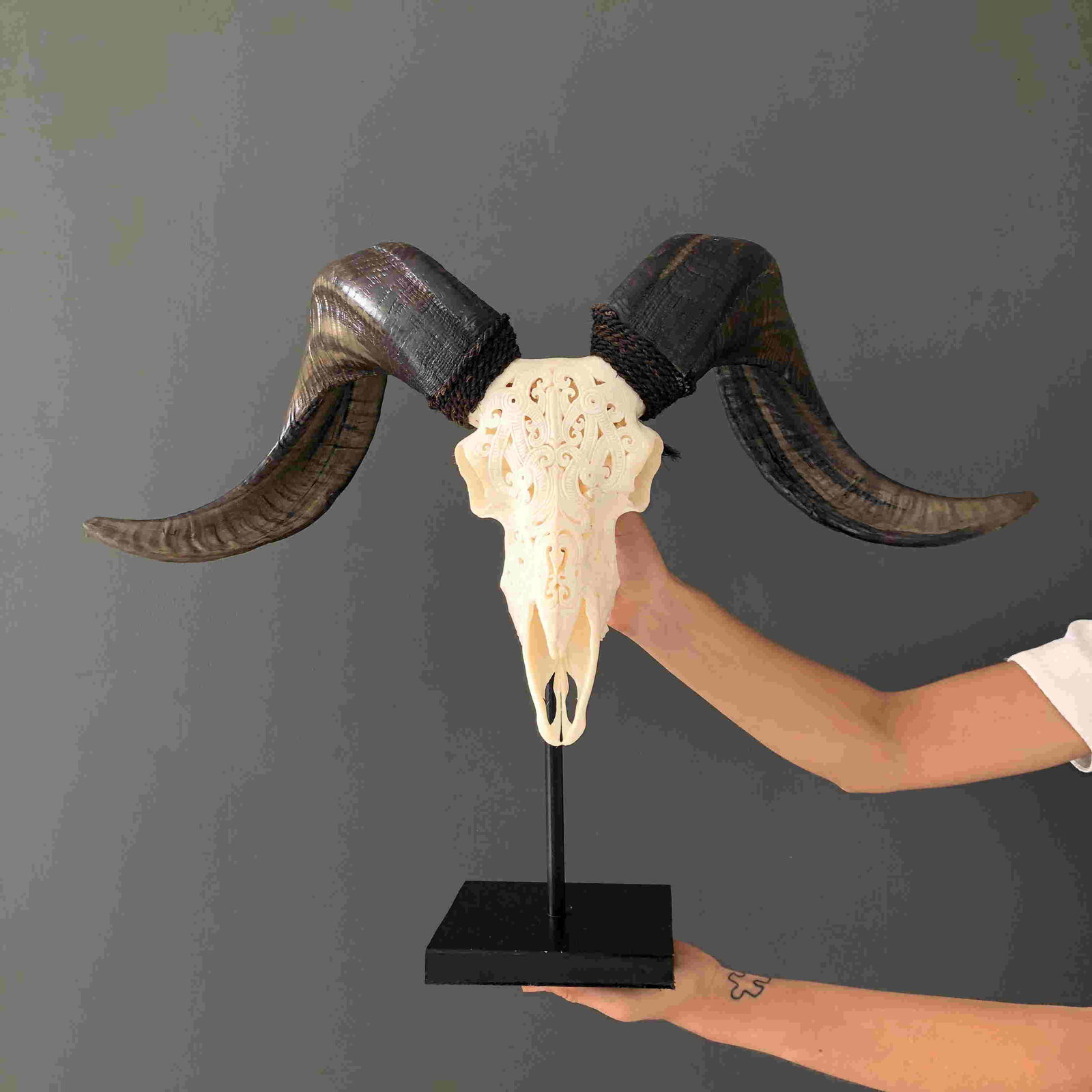 White Ram Skull -Tribal motif: Title: White Ram Skull -Tribal motif Maker: Unknown Origin: Bali, Indonesia Date/Period: 2021 Materials: Bone, Ovis aries Dimensions:Dimensions including stand: Height: 46 cm / 18.1 inches Width: 64 c