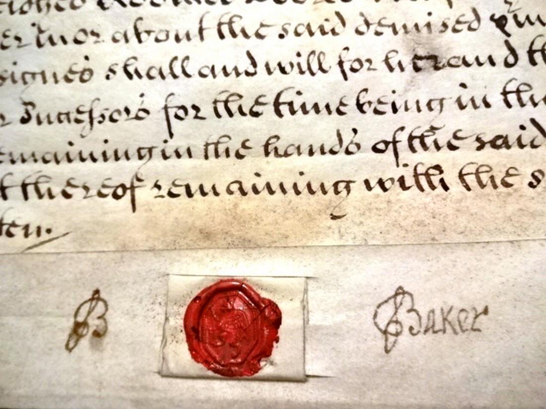 1701 Vellum Deed London Cheapside: Beautifully penned with wonderful calligraphy English vellum deed pertaining to a house in Cheapside in London owned by te Baker family and conveyed by the Dean and chapter of St. Paul. On two vellum 