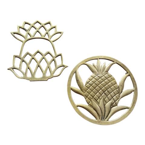 1970s Brass Pineapple Trivets - a Pair: Beautiful set of brass pineapple trivets. Perfect for the interior designer. Reserve: $49.00 Shipping: Domestic: Flat-rate of $19.00 to anywhere within the contiguous U.S. International: Foreign shipp