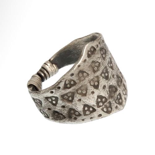 Viking Silver Ring with Wolf's Tooth Decoration, c.: Title: Viking Silver Ring with Wolf's Tooth Decoration, c. 9th - 11th century A.D. Date & Origin: Viking, c. 9th - 11th century A.D. Description: Silver ring formed as a flat-section plaque tapering t