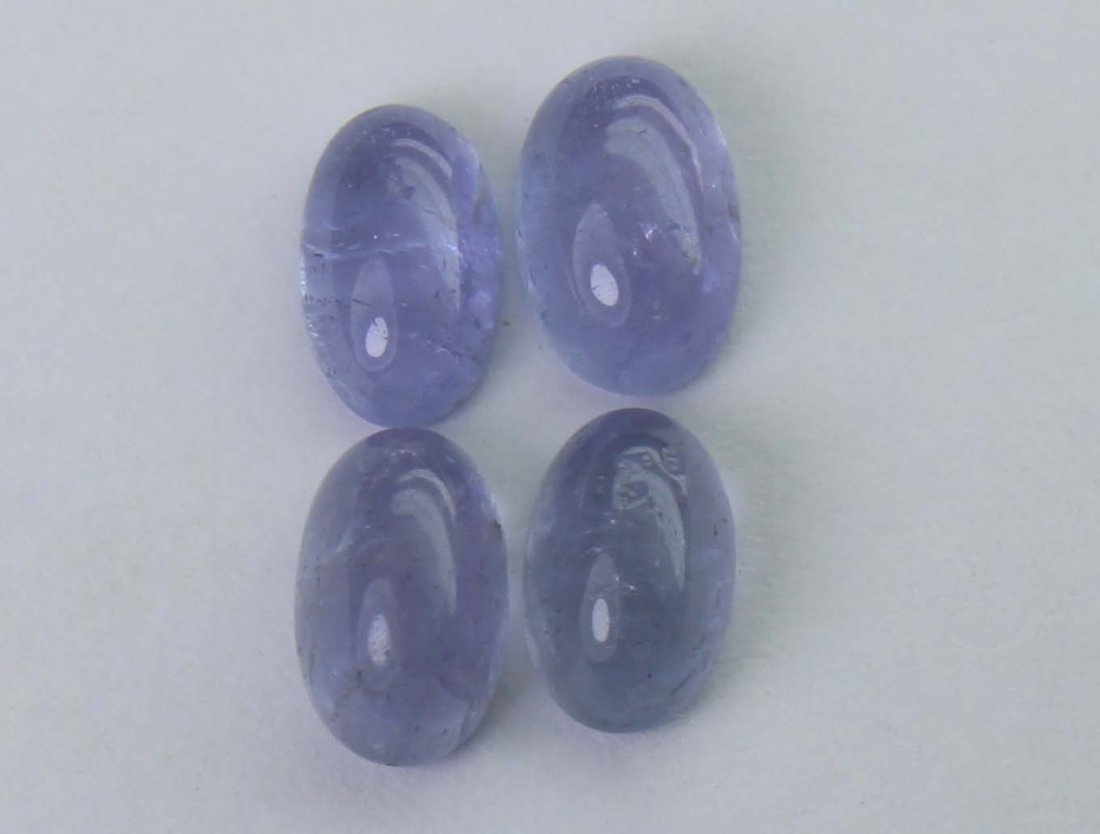 2.12 cts Natural Tanzanite: No Reserve! Title: 2.12 cts Natural Tanzanite Additional Information: Gemstone : Natural Tanzanite Shape and cut : Oval cabochan Weight : 2.12 Carats Measurements : 6.00x3.82x3.06 mm - 5.64x3.61x2.10 