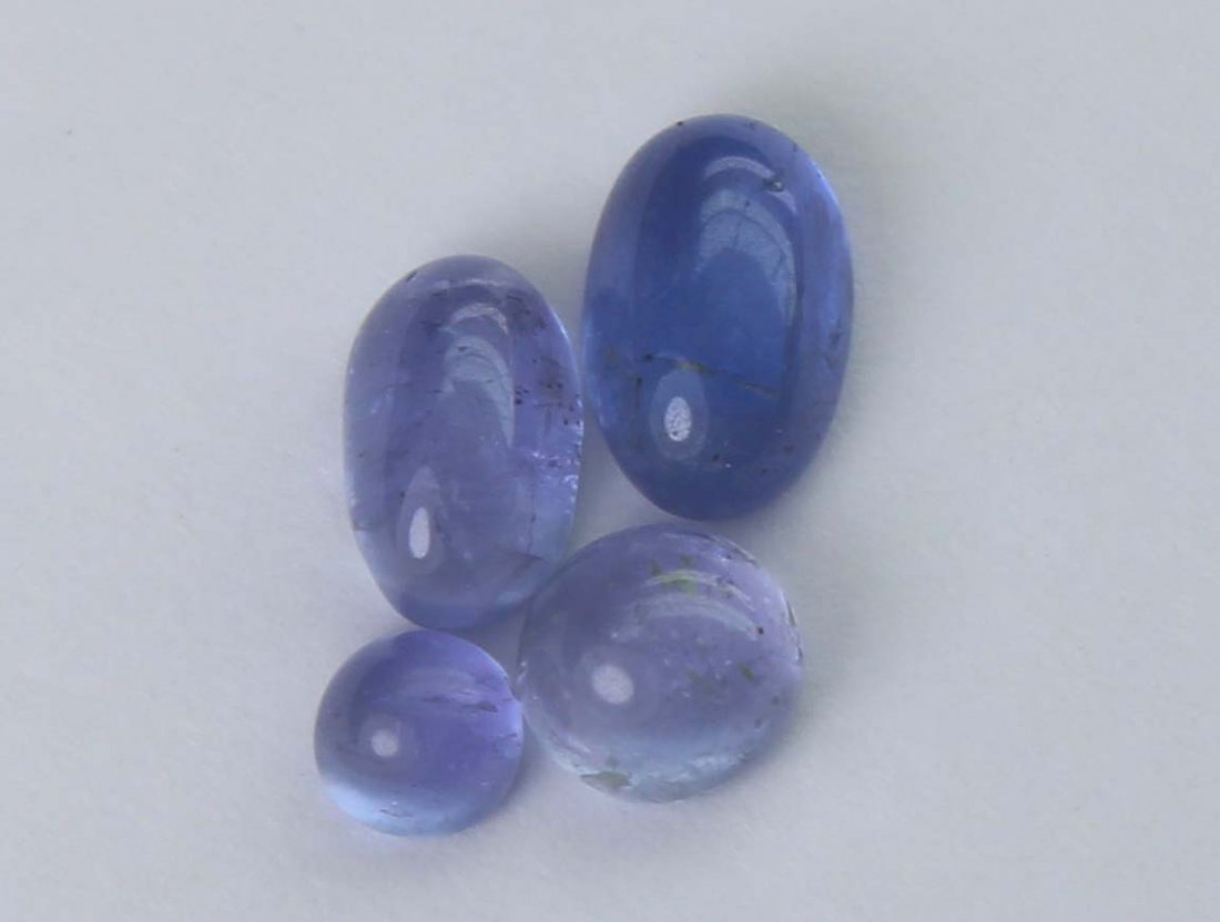 1.47 cts Natural Tanzanite: No Reserve! Title: 1.47 cts Natural Tanzanite Additional Information: Gemstone : Natural Tanzanite Shape and cut : Oval Round cabochan Weight : 1.47 Carats Measurements : 5.70x3.70x2.79 mm - 2.86x2.69