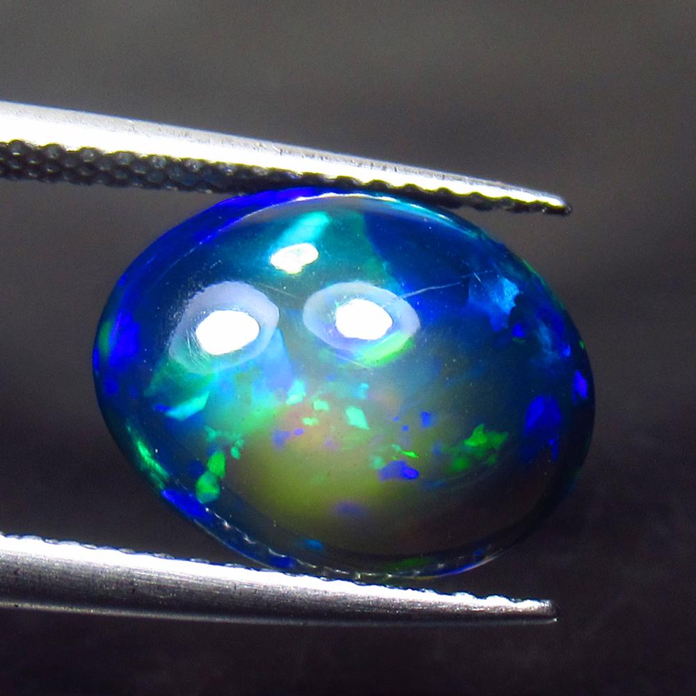 3.72 Ctw Natural Ethiopian Black Fire Opal Oval Cab: No Reserve! Title: 3.72 Ctw Natural Ethiopian Black Fire Opal Oval Cab Stone Clarity: Translucent Gemstones: Black Opal Carat Weights: 3.72 Size/Dimensions: 12.60 x 10.10 x 5.70 mm Additional Informat