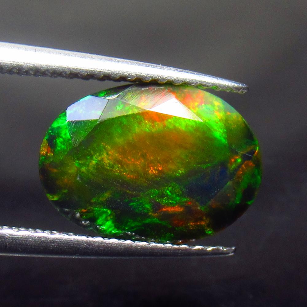 2.96 Ctw Natural Ethiopian Black Fire Opal Oval Cut: No Reserve! Title: 2.96 Ctw Natural Ethiopian Black Fire Opal Oval Cut Stone Clarity: Opaque Gemstones: Black Opal Carat Weights: 2.96 Size/Dimensions: 12.00 x 8.70 x 6.60 mm Additional Information: E
