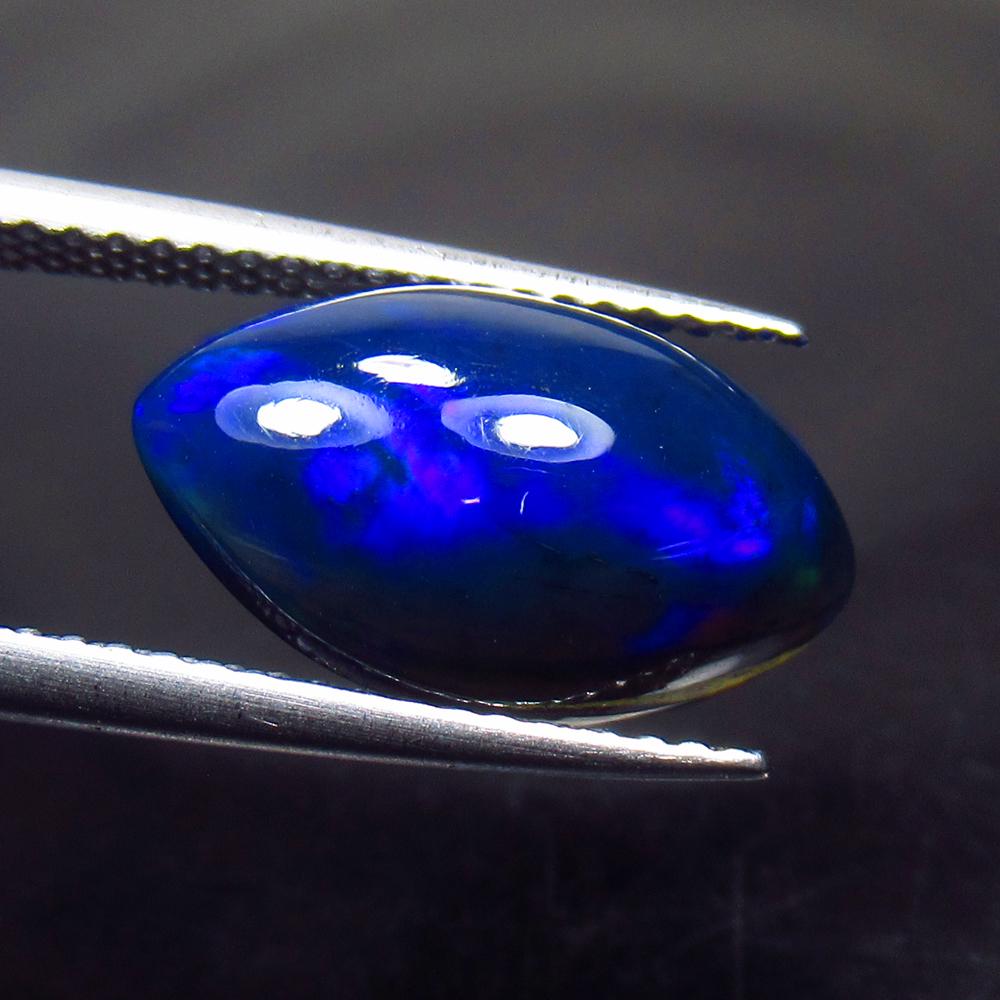 2.85 Ctw Natural Ethiopian Black Fire Opal Marquise Cab: No Reserve! Title: 2.85 Ctw Natural Ethiopian Black Fire Opal Marquise Cab Stone Clarity: Translucent Gemstones: Black Opal Carat Weights: 2.85 Size/Dimensions: 15.40 x 8.60 x 5.10 mm Additional Infor