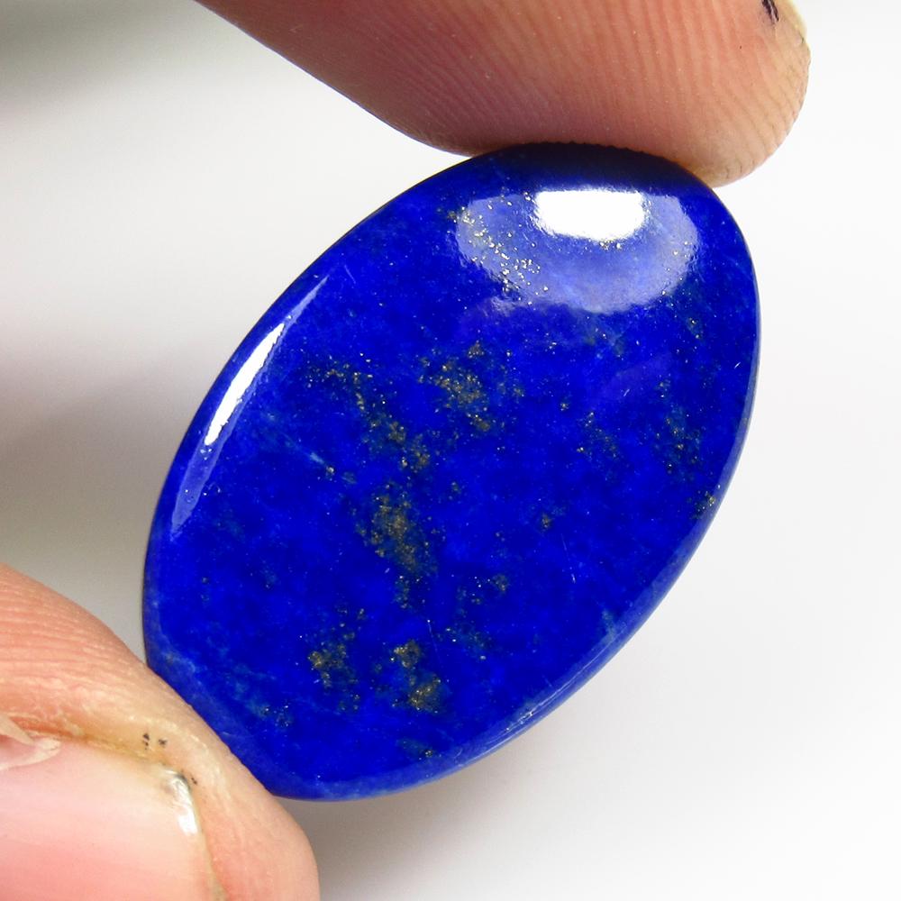 22.14 Ctw Natural Lapis Lazuli Oval Cab: No Reserve! Title: 22.14 Ctw Natural Lapis Lazuli Oval Cab Stone Clarity: Opaque Gemstones: Lapis Lazuli Carat Weights: 22.14 Size/Dimensions: 27.00 x 16.90 x 4.90 mm Additional Information: Nice Oval