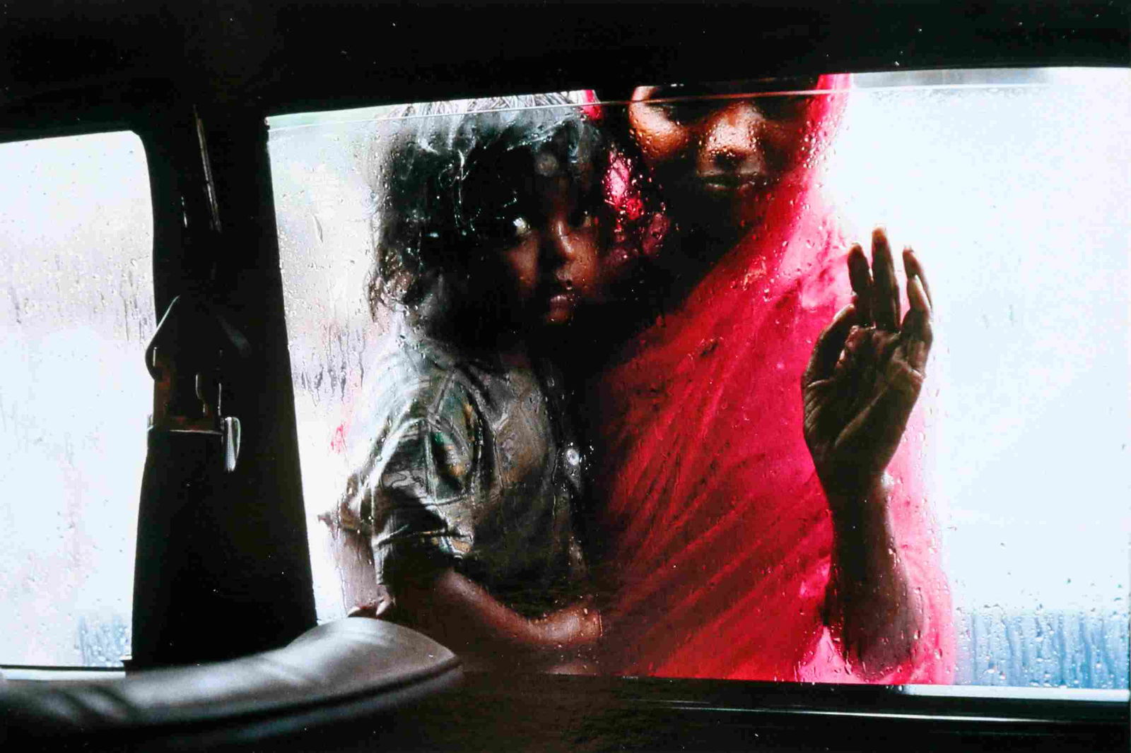Steve McCurry - Mother and child at Car window,: Artist: Steve McCurry Title: Mother and child at Car window, Bombay, India, 1993 Date Printed: 2008 Medium: High Quality Photo Print with Copyright Steve McCurry/Magnum Photos Print Origin: Printed in