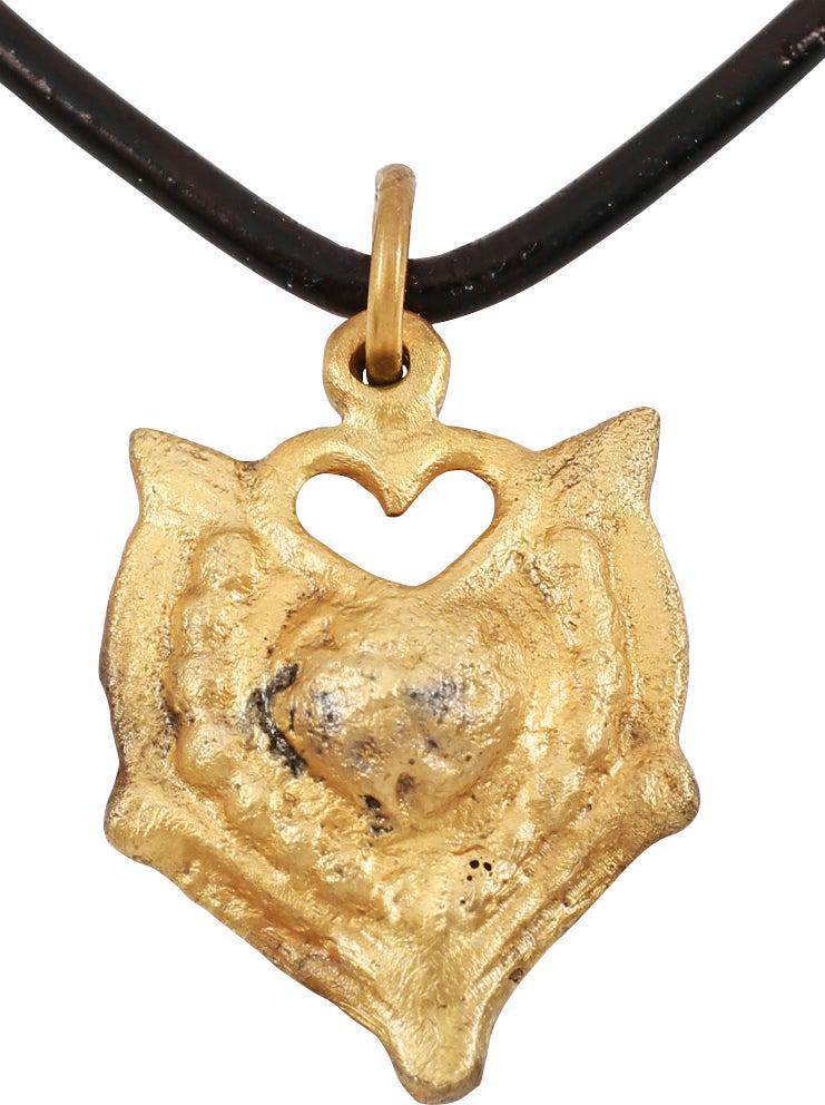 EXCEPTIONAL VIKING HEART NECKLACE, 10TH-11TH C.AD: Over 7/8" height. Cusped form heart with the cusp formed by a second heart. A heart within a heart! scalloped borders and the quarter points with radials, forming a saltire. Well preserved with the in