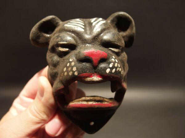 Cast Iron wall mount folk art Bulldog Beer Bottle: 4" Tall x 3 1/2" Wide Such a neat reproduction antique cast iron bulldog wall mounted bottle cap opener. The mouth of the bulldog is where you would open the bottle. Certainly a great accent piece! Be