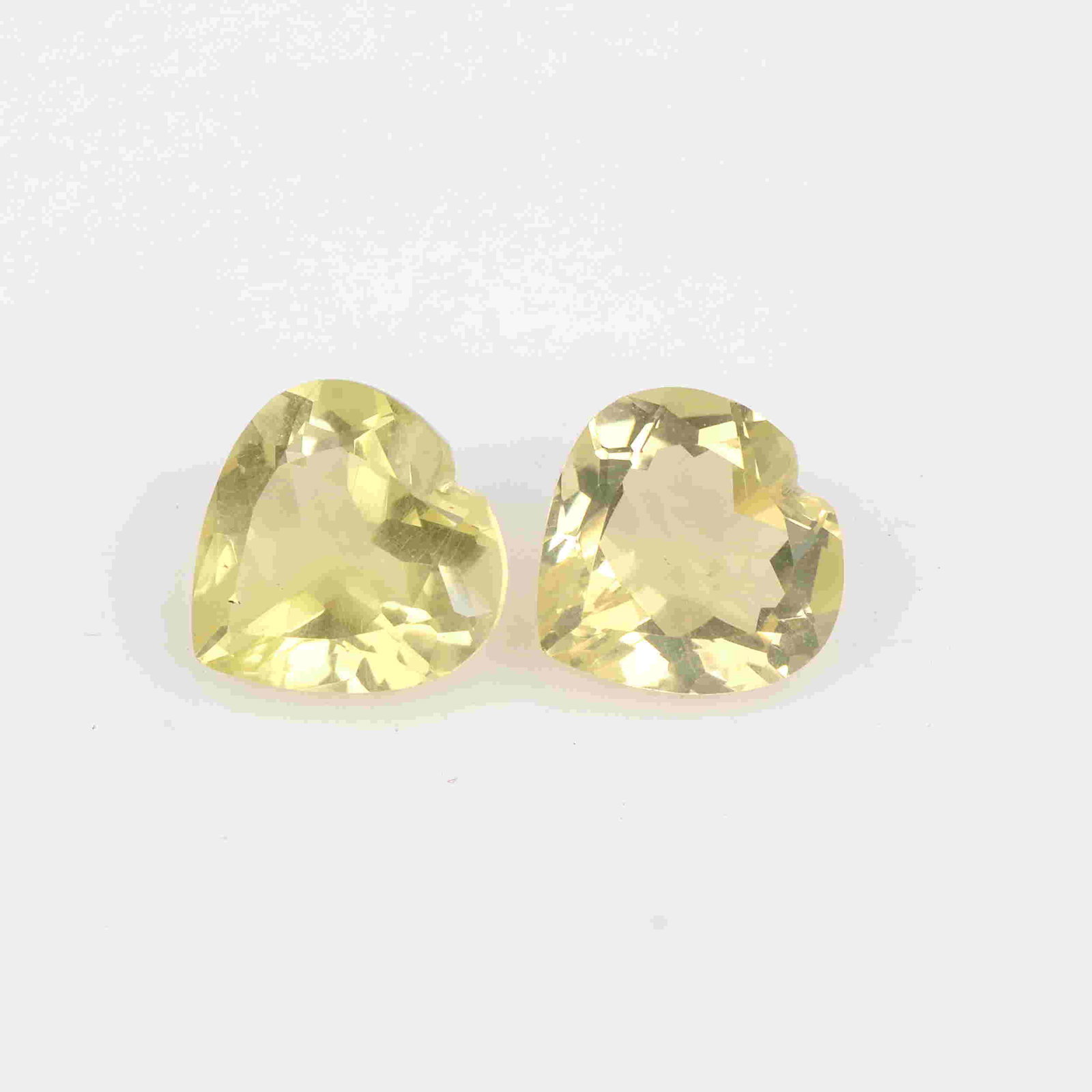 5.70 Carat Yellow Color Natural Heart Lemon Quartz: No Reserve! Title: 5.70 Carat Yellow Color Natural Heart Lemon Quartz Loose Gemstone 2 Pieces Brand: Gems Trading Center Gemstones: Lemon Quartz Carat Weights: 5.7 Size/Dimensions: 5.5H x 10L x 10W mm