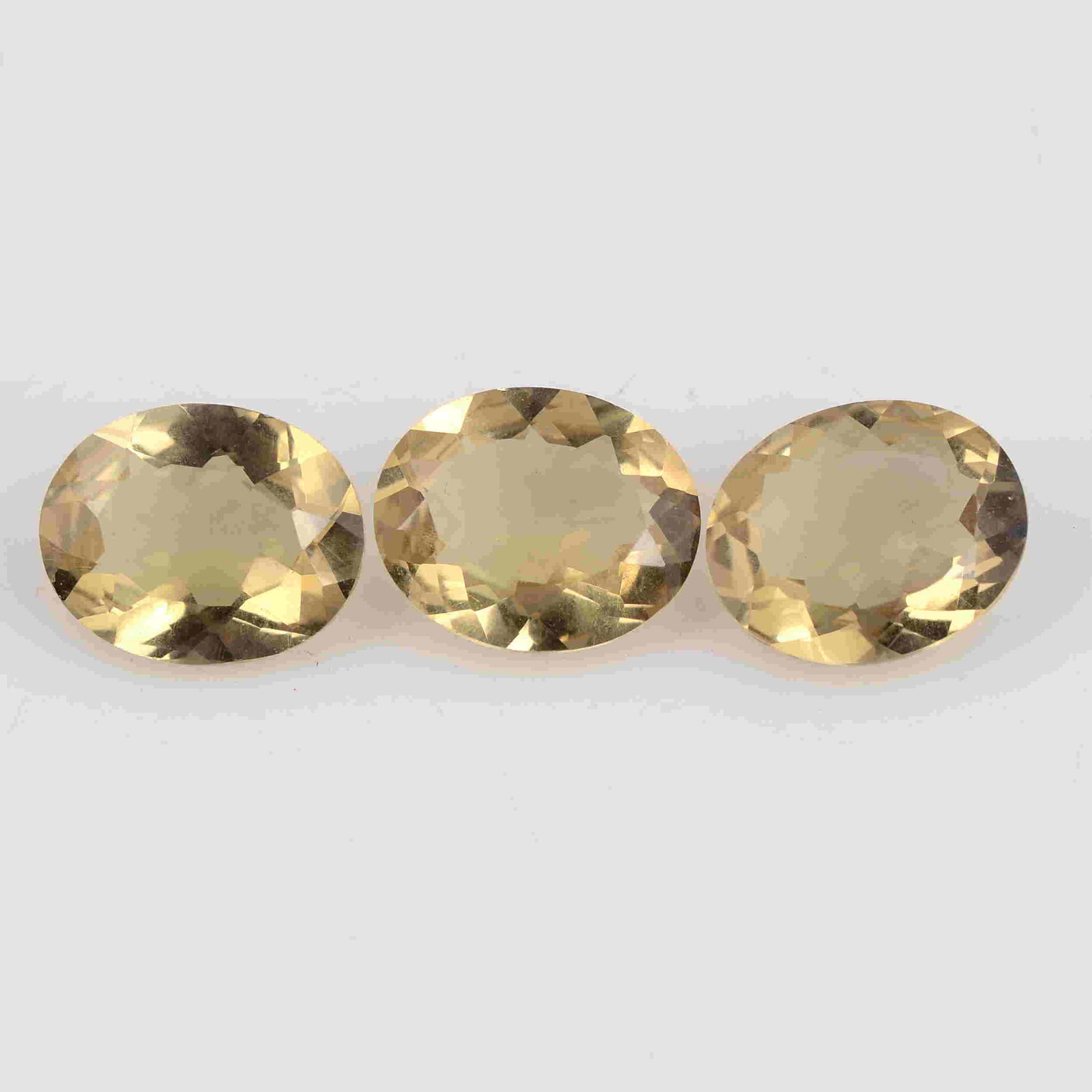 7.70 Carat Whiskey Color Natural Oval Lemon Quartz: No Reserve! Title: 7.70 Carat Whiskey Color Natural Oval Lemon Quartz Loose Gemstone 3 Pieces Brand: Gems Trading Center Gemstones: Lemon Quartz Carat Weights: 7.7 Size/Dimensions: 4.5H x 11L x 9W mm 