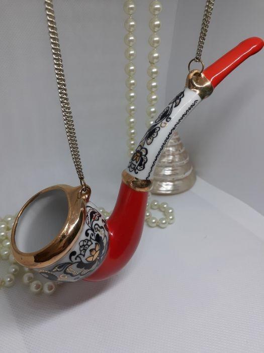 Smoking pipe statue Kiev cradle porcelain souvenir USSR: Title: Smoking pipe statue Kiev cradle porcelain souvenir USSR Date/Period: 1970 Materials: Porcelain, Silver plated chains Dimensions: Lenght: 6.7 inch Description:This is a vintage piece of decor, i