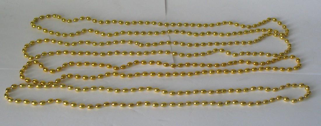 Vintage feather tree glass Christmas tree garland.: Title: Vintage feather tree glass Christmas tree garland. Provenance/Additional Info: Four loops of vintage gold glass feather tree garlands. Dimensions: About 110" total Circa: 1950's Shipping: Domes