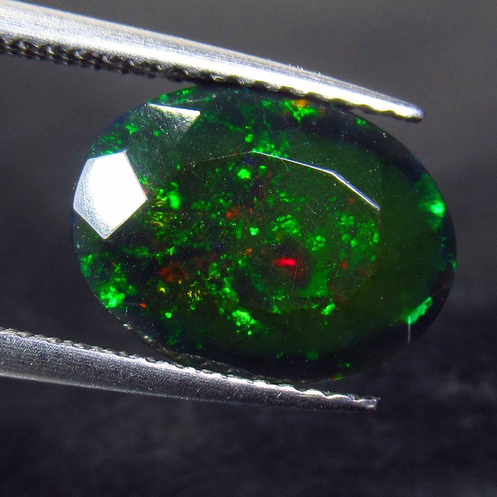 2.37 Ctw Natural Ethiopian Black Fire Opal Oval Cut: Title: 2.37 Ctw Natural Ethiopian Black Fire Opal Oval Cut Stone Clarity: Translucent Gemstone: Black Opal Carat Weights: 2.37 Size/ Dimensions: 12.30 x 9.30 x 5.50 mm Additional Info: Excellent Oval 
