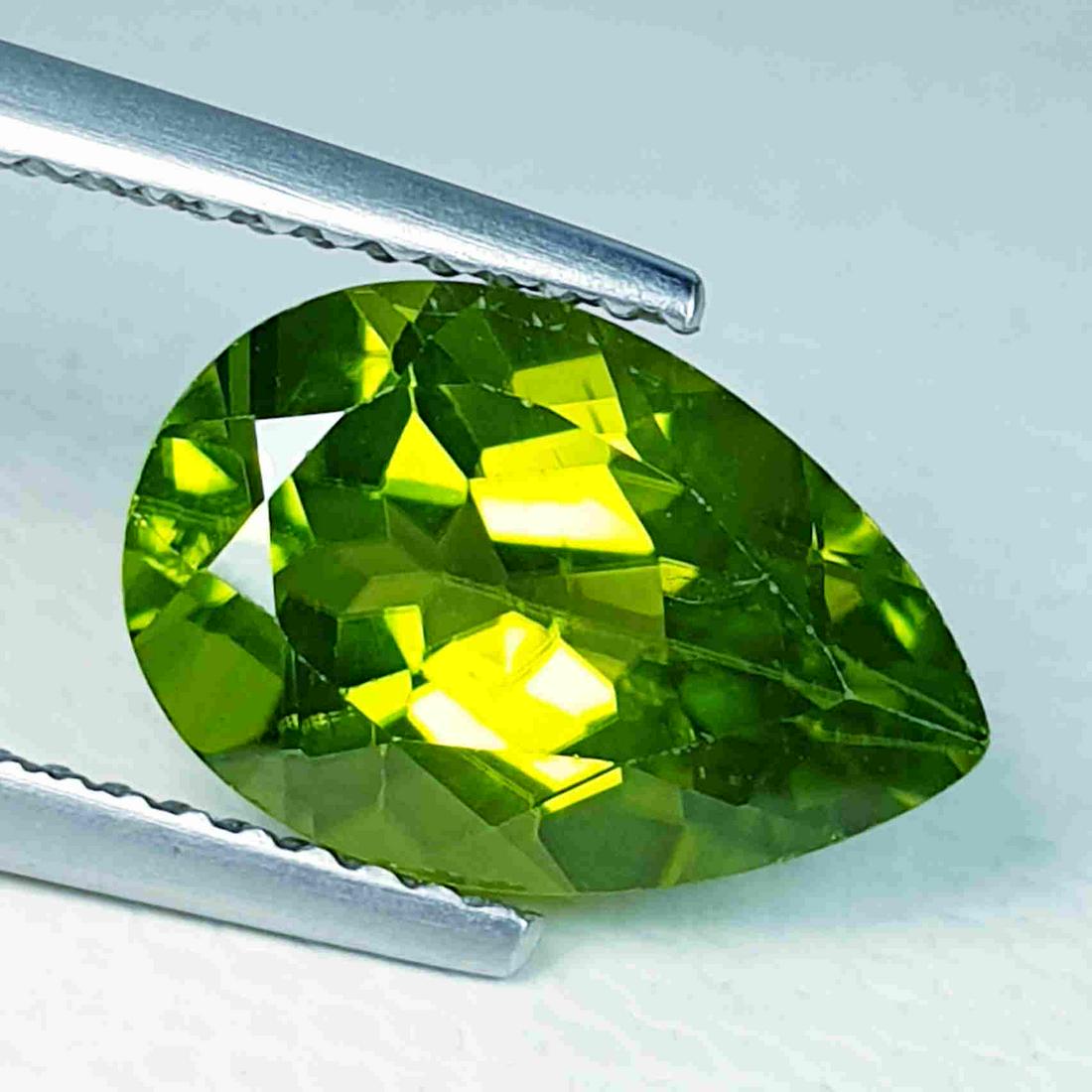 3.65 ct "IGI Certified" Natural Peridot: Title: 3.65 ct "IGI Certified" Natural Peridot Brand: Peridot Gemstones: Loosegemstone Color/Clarity: VVS Carat Weights: 3.65 Size/Dimensions: 12.06 x 8.03 x 5.69 Additional Information: International