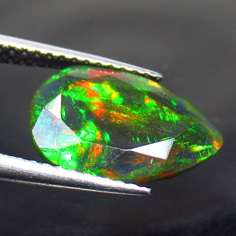 2.67 Ctw Natural Ethiopian Black Fire Opal Pear Cut: Title: 2.67 Ctw Natural Ethiopian Black Fire Opal Pear Cut Stone Clarity: Opaque Gemstones: Black Opal Carat Weights: 2.67 Size/Dimensions: 13.00 x 9.30 x 7.10 mm Additional Information: Excellent Pea
