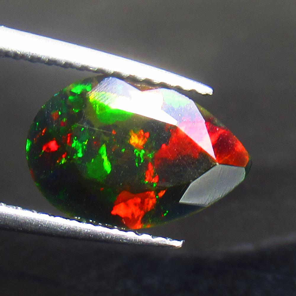 1.77 Ctw Natural Ethiopian Black Fire Opal Pear Cut: Title: 1.77 Ctw Natural Ethiopian Black Fire Opal Pear Cut Stone Clarity: Translucent Gemstone: Black Opal Carat Weights: 1.77 Size/ Dimensions: 12.20 x 8.10 x 4.70 mm Additional Info: Excellent Pear 