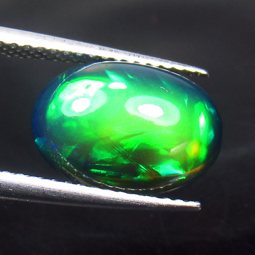 3.00 Ct Natural Ethiopian Black Fire Opal Oval Cab: Title: 3.00 Ct Natural Ethiopian Black Fire Opal Oval Cab Stone Clarity: Translucent Gemstones: Natural Black Opal Carat Weights: 3 Size/Dimensions: 12.60 x 8.80 x 5.60 mm Additional Information: Exce