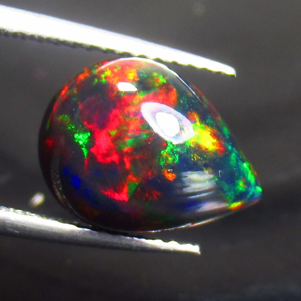 3.07 Ct Natural Black Fire Opal Pear Cab (1 of 2)