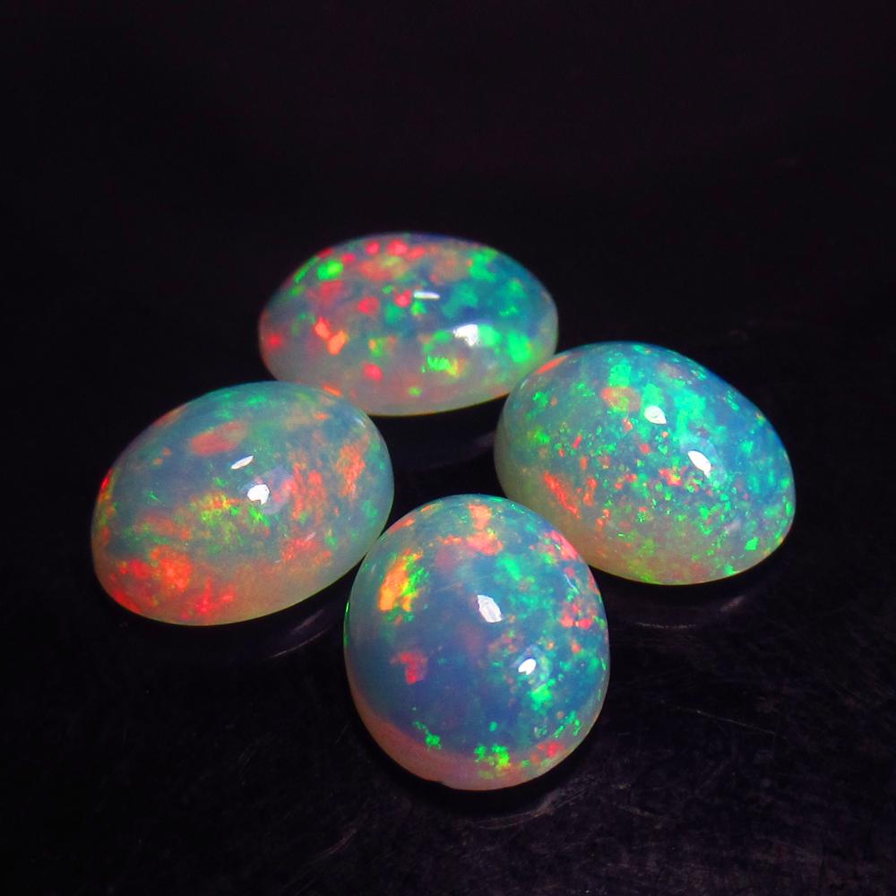 4.81 Ctw Natural 4 Multi-Color Welo Opal Oval Set: Title: 4.81 Ctw Natural 4 Multi-Color Welo Opal Oval Set Stone Clarity: Transparent Gemstone: Natural Opal Carat Weights: 4.83 Size/ Dimensions: 9.1x7.1 - 9.2x7.2 mm / 4 Pc's Additional Info: Excellen