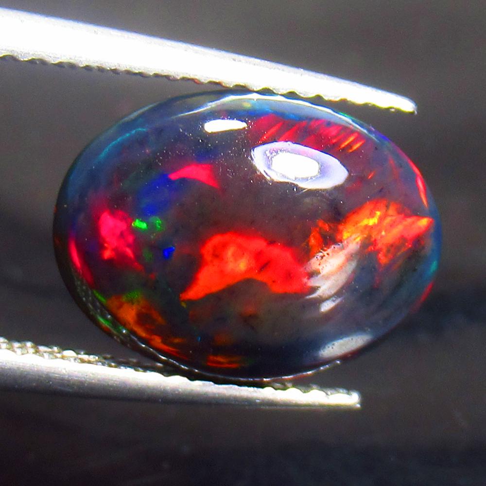2.25 Ctw Natural Ethiopian Black Fire Opal Oval Cab: Title: 2.25 Ctw Natural Ethiopian Black Fire Opal Oval Cab Stone Clarity: Translucent Gemstone: Black Opal Carat Weights: 2.25 Size/ Dimensions: 12.50 x 9.30 x 4.20 mm Additional Info: Excellent Oval 