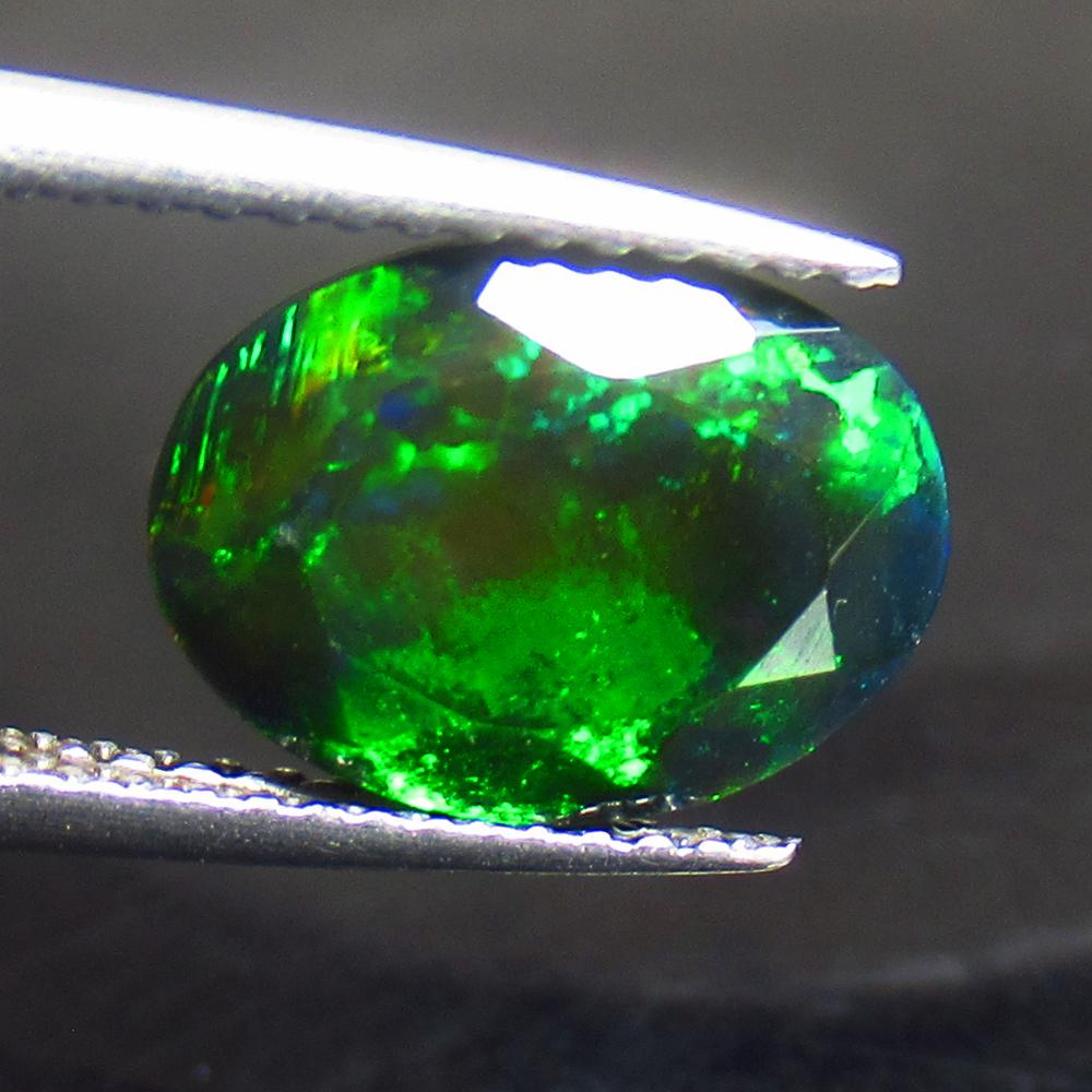 2.07 Ctw Natural Ethiopian Black Fire Opal Oval Cut: Title: 2.07 Ctw Natural Ethiopian Black Fire Opal Oval Cut Stone Clarity: Translucent Gemstone: Black Opal Carat Weights: 2.07 Size/ Dimensions: 11.10 x 8.20 x 5.40 mm Additional Info: Excellent Oval 