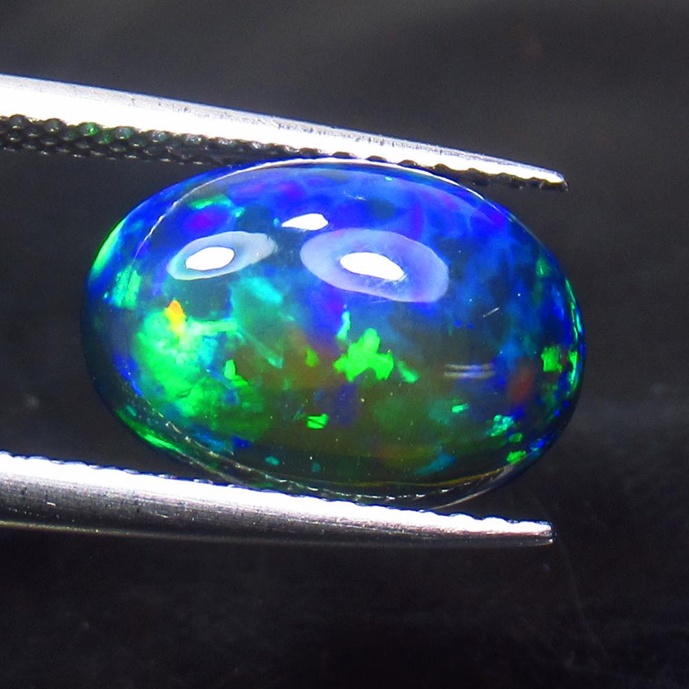 3.07 Ct Natural Ethiopian Black Fire Opal Oval Cab: Title: 3.07 Ct Natural Ethiopian Black Fire Opal Oval Cab Stone Clarity: Translucent Gemstones: Natural Black Opal Carat Weights: 3.07 Size/Dimensions: 12.80 x 8.90 x 5.50 mm Additional Information: E