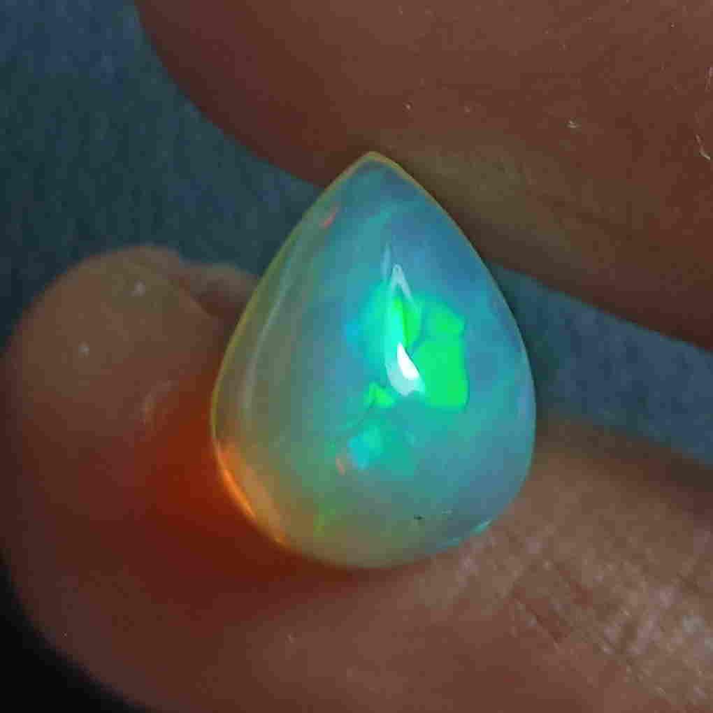 1.65 CTS NATURAL ETHIOPIAN WELO OPAL PEAR GOOD LUSTER: Title: 1.65 CTS NATURAL ETHIOPIAN WELO OPAL PEAR GOOD LUSTER LOOSE GEMSTONES Carat Weights: 1.65 Size/Dimensions: 9.8 x 7.6 x 5.0 MM Additional Information: UNHEATED ETHIOPIAN Reserve: $30.00 Shipping