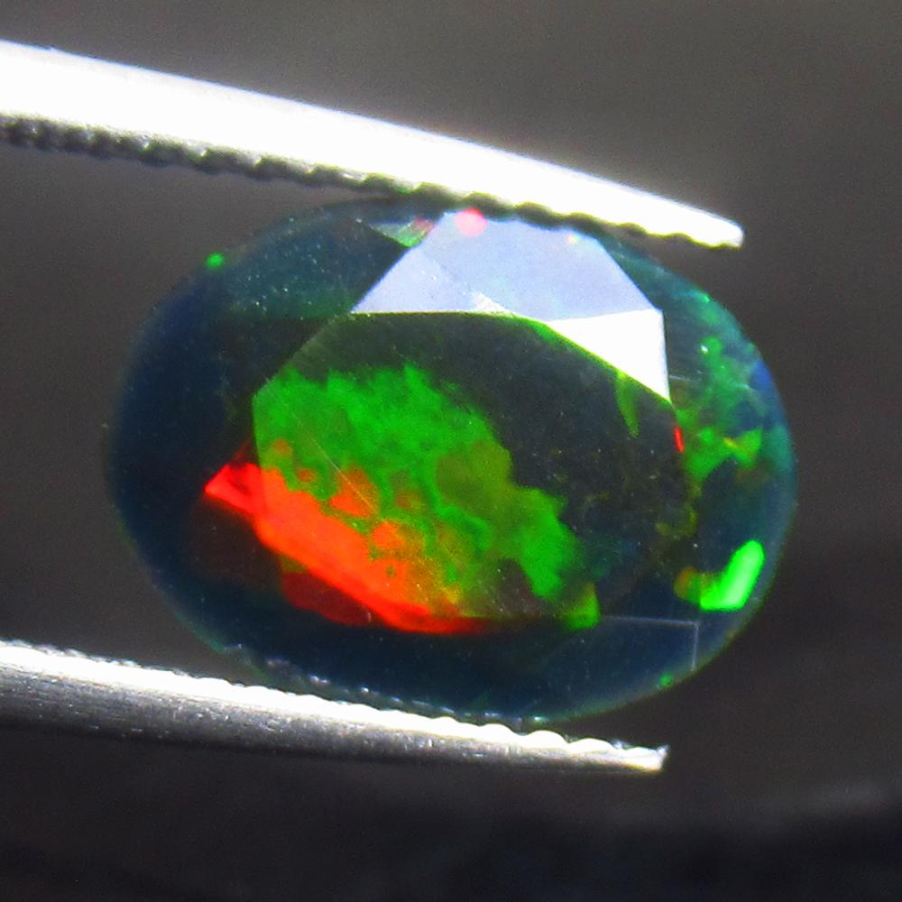 1.89 Ctw Natural Ethiopian Black Fire Opal Oval Cut: Title: 1.89 Ctw Natural Ethiopian Black Fire Opal Oval Cut Stone Clarity: Translucent Gemstone: Black Opal Carat Weights: 1.89 Size/ Dimensions: 11.40 x 8.60 x 4.90 mm Additional Info: Excellent Oval 