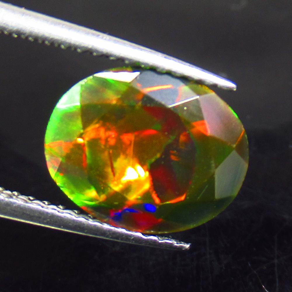 1.95 Ctw Natural Ethiopian Black Fire Opal Oval Cut: Title: 1.95 Ctw Natural Ethiopian Black Fire Opal Oval Cut Stone Clarity: Translucent Gemstone: Black Opal Carat Weights: 1.95 Size/ Dimensions: 11.00 x 8.90 x 5.00 mm Additional Info: Excellent Oval 