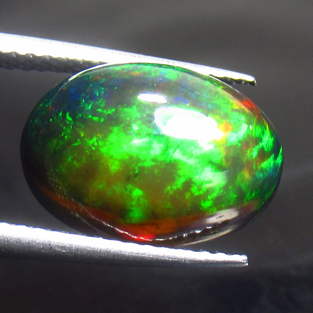 4.76 Ct Natural Ethiopian Black Fire Opal Oval Cab: Title: 4.76 Ct Natural Ethiopian Black Fire Opal Oval Cab Stone Clarity: Translucent Gemstones: Natural Black Opal Carat Weights: 4.76 Size/Dimensions: 13.70 x 9.40 x 6.80 mm Additional Information: E