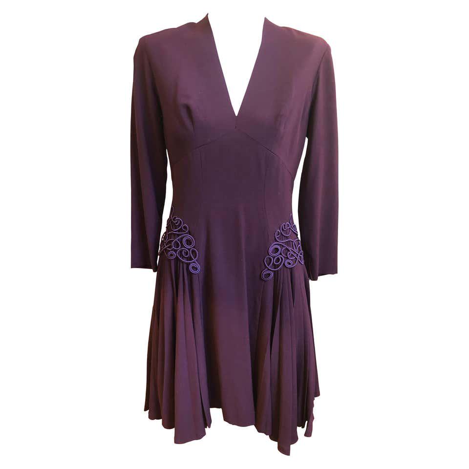 Jacques FATH Museum 1940s Quality Aubergine Wool Crepe: This is an incredible 1940s Jacques Fath Dress (Jacques Fath passed away in 1954) in excellent condition. Some of the details are decorative braiding; soft pleats; longer side hems; darting, and zips