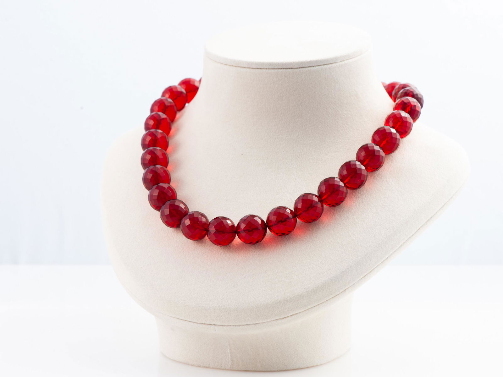Red Amber Necklace/Collier: Title: Red Amber Necklace/Collier Materials: Red amber Weight in grams: 50.4 Additional Information: Ruby Red amber necklace/collier made of faceted ball beads. Beads dimensions: 14mm/0.55inch. Reserv