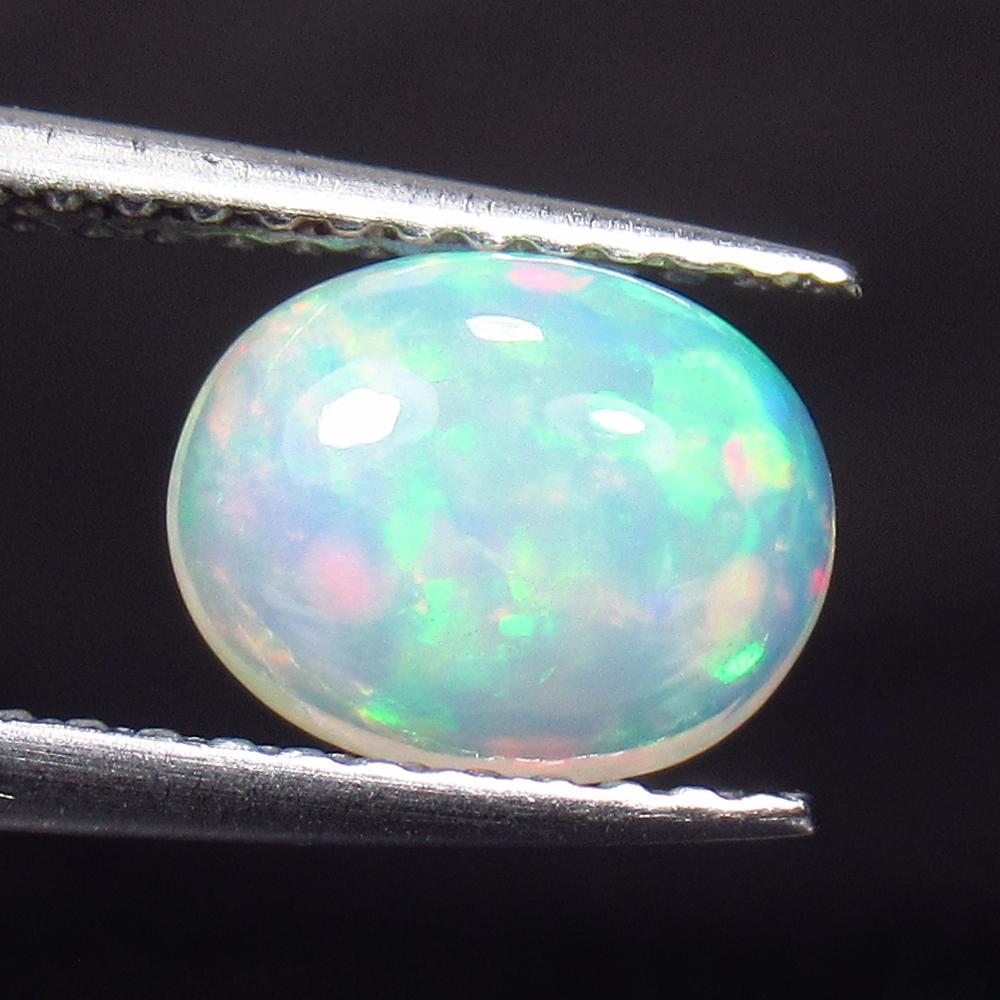 0.87 Ct Natural Multi-Color Opal Oval Cab (1 of 2)
