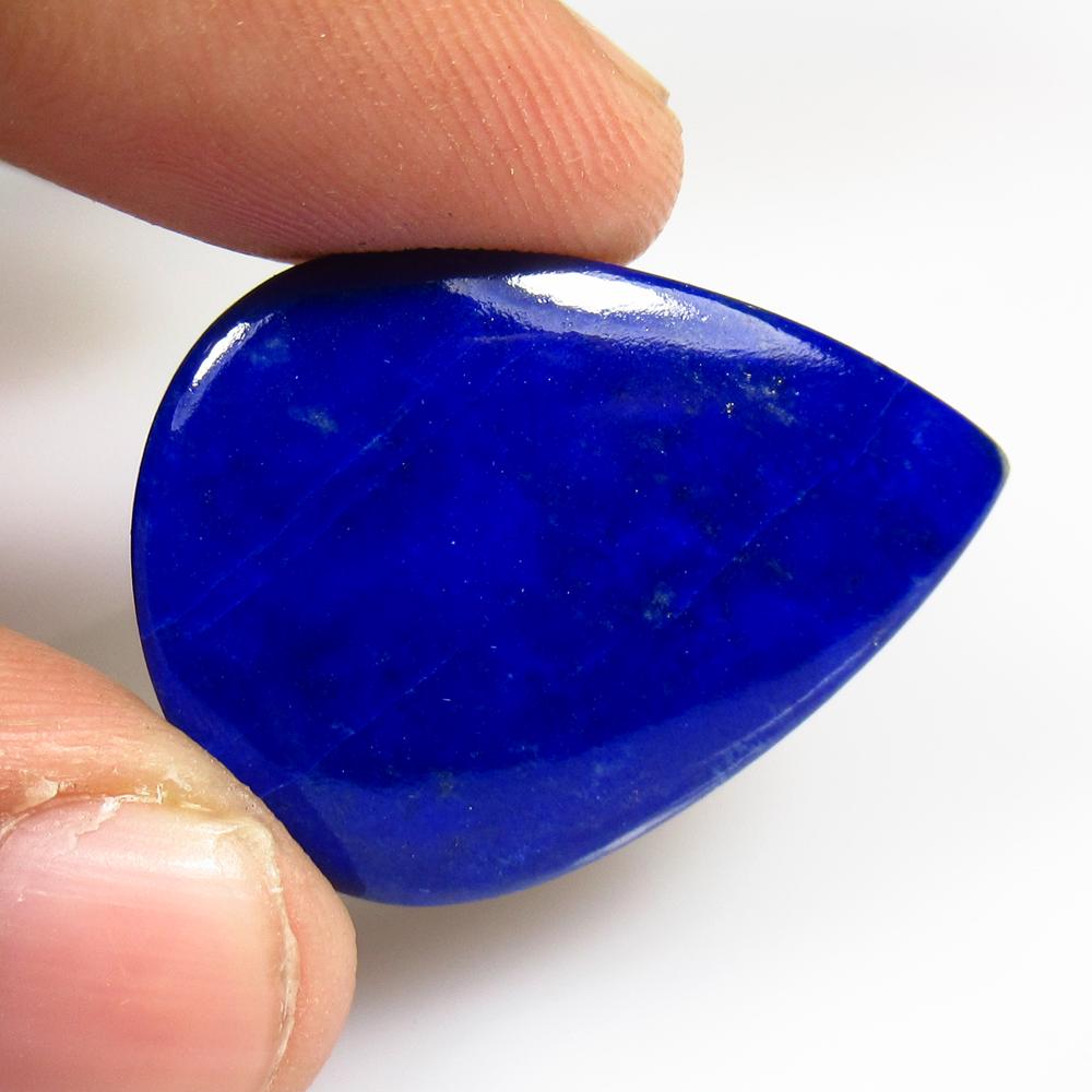 30.76 Ct Natural Lapis Lazuli Pear Cab: No Reserve! Title: 30.76 Ct Natural Lapis Lazuli Pear Cab Stone Clarity: Opaque Gemstones: Natural Lapis Lazuli Carat Weights: 30.76 Size/Dimensions: 31.00 x 25.00 x 5.20 mm Additional Information: Ni